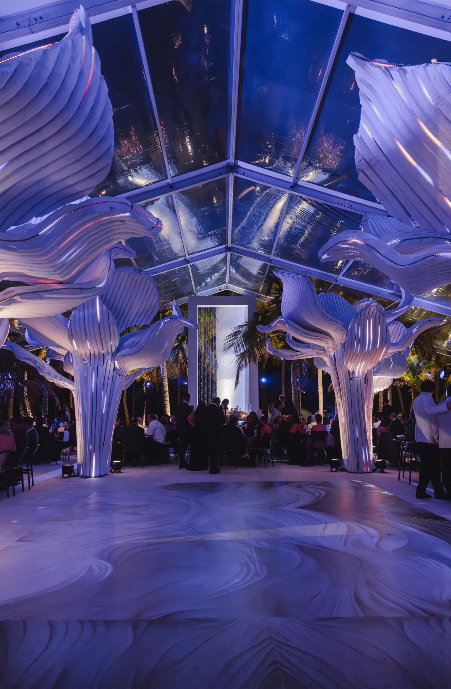 White architectural interior transformed with blue lighting